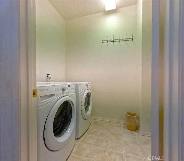 28183 Rocky Cove Dr, Menifee, CA 92585 - laundry room with washer and dryer and baseboards