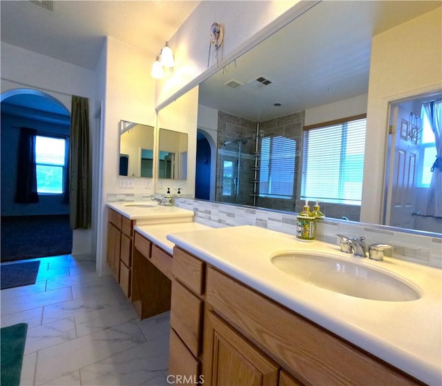 28183 Rocky Cove Dr, Menifee, CA 92585 - bathroom with vanity, a shower stall, and marble look tiles