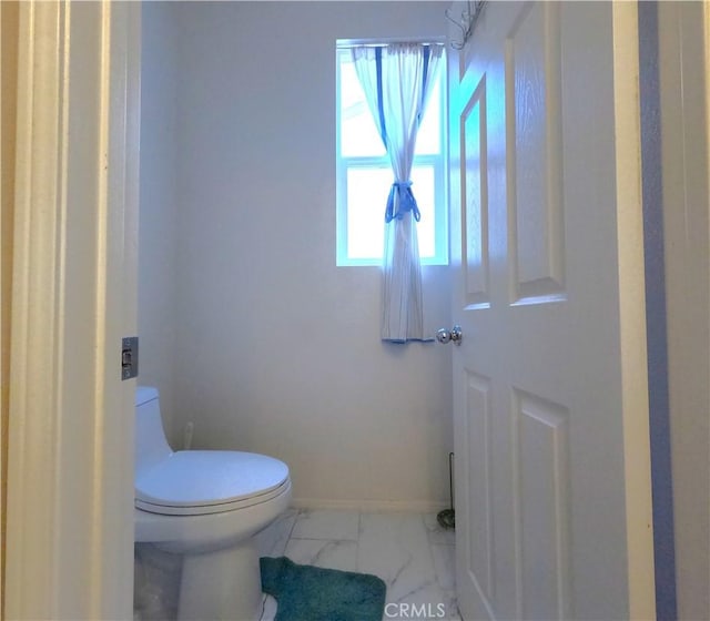 28183 Rocky Cove Dr, Menifee, CA 92585 - bathroom featuring toilet and marble look tiles