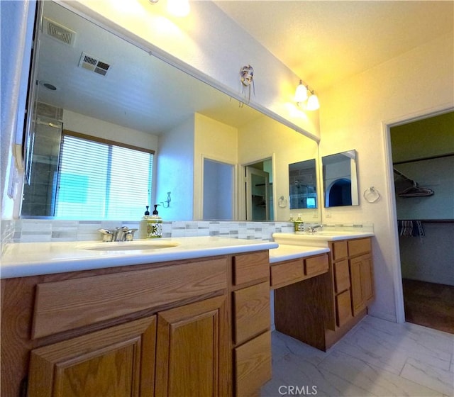 28183 Rocky Cove Dr, Menifee, CA 92585 - bathroom featuring vanity, a spacious closet, and marble finish floors