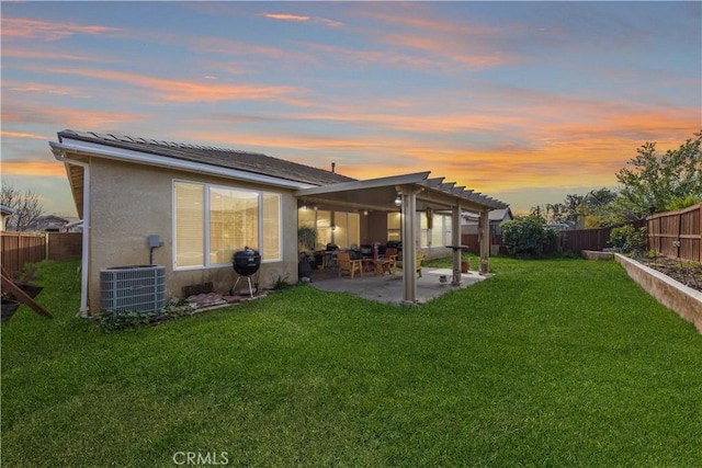 28183 Rocky Cove Dr, Menifee, CA 92585 - back of house at dusk featuring a fenced backyard, a patio area, and stucco siding