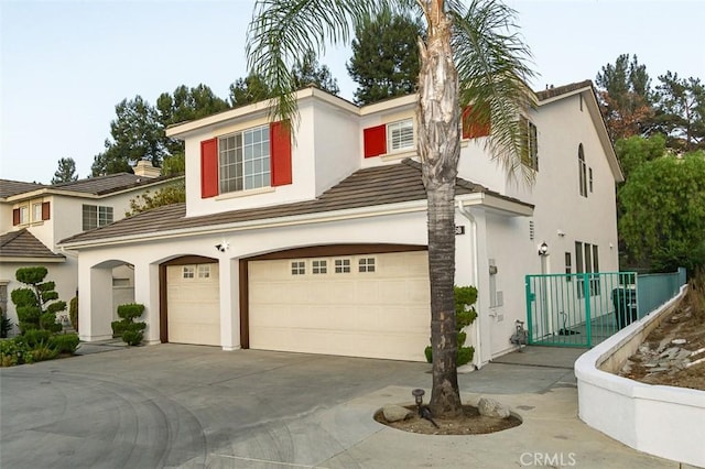 2768 Somerset Pl, Rowland Heights, CA 91748 - view of front of home with a garage, driveway, a tile roof, and stucco siding