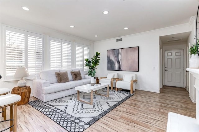 2768 Somerset Pl, Rowland Heights, CA 91748 - living room featuring recessed lighting, visible vents, ornamental molding, and light wood-style floors