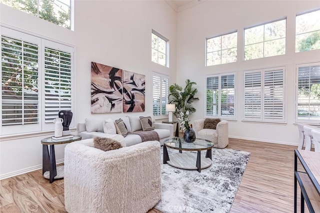 2768 Somerset Pl, Rowland Heights, CA 91748 - living area featuring crown molding, baseboards, and wood finished floors