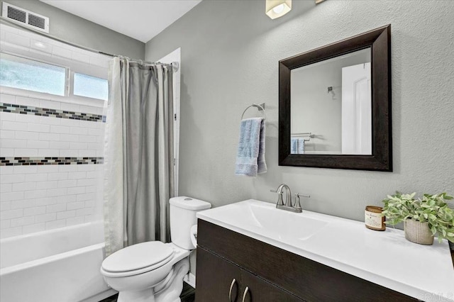 full bath with visible vents, toilet, vanity, and shower / bath combination with curtain