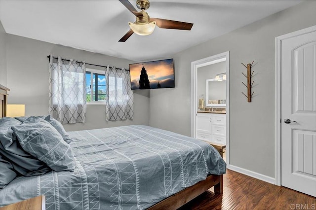 bedroom with ceiling fan, ensuite bathroom, baseboards, and wood finished floors