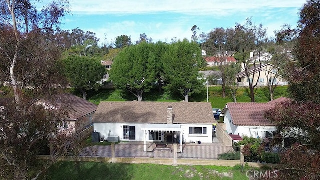 back of house with a patio, a fenced backyard, and stucco siding