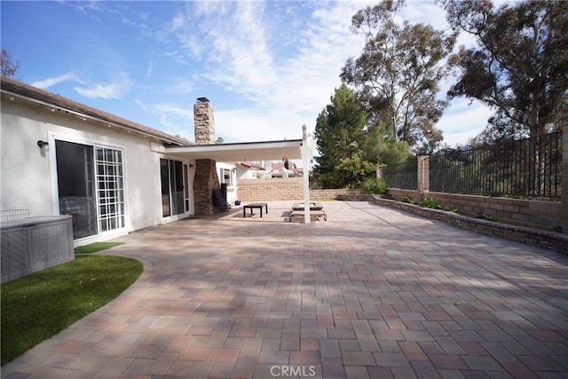view of patio / terrace featuring fence