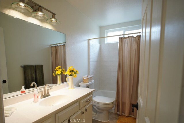 full bathroom featuring toilet, shower / tub combo, and vanity