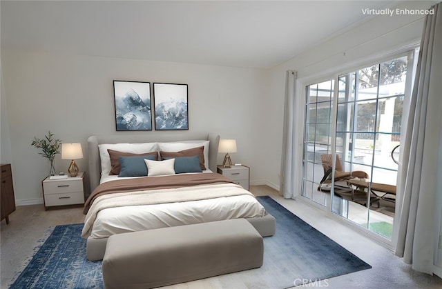 bedroom featuring access to exterior and baseboards