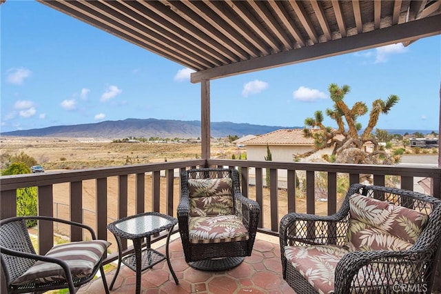 balcony featuring a mountain view