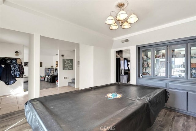 rec room featuring visible vents, an inviting chandelier, wood finished floors, and pool table