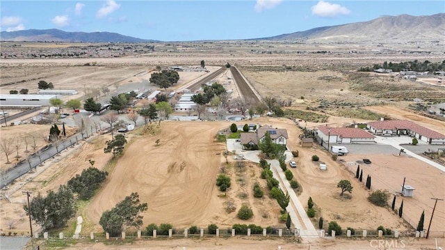 aerial view with a mountain view and a rural view