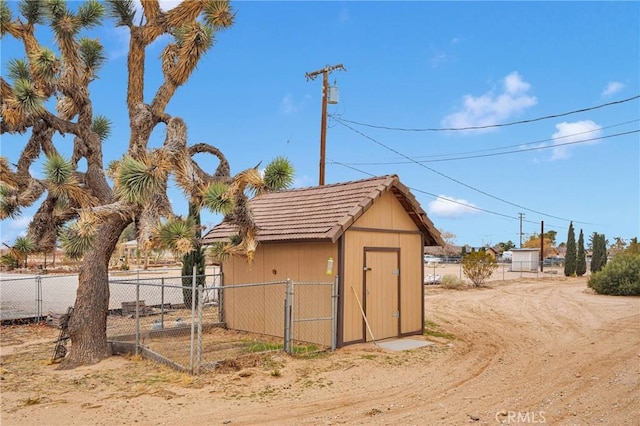 view of shed with fence