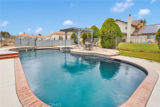 view of pool featuring a patio, a fenced backyard, a pergola, a pool with connected hot tub, and a lawn