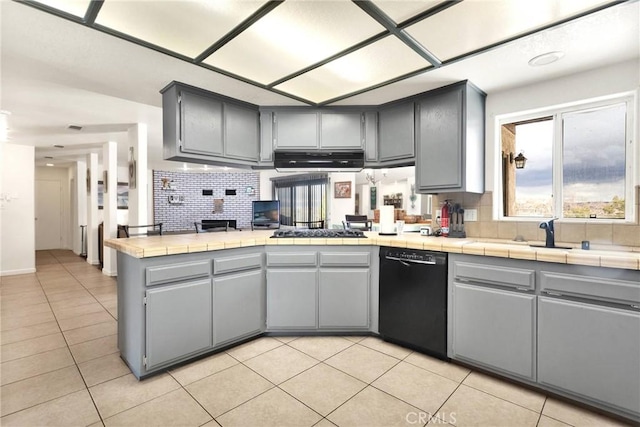 kitchen with gas cooktop, light tile patterned floors, gray cabinets, black dishwasher, and backsplash