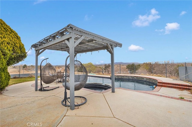 outdoor pool with a fenced backyard, an in ground hot tub, a pergola, and a patio