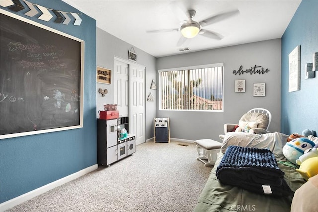 bedroom with visible vents, baseboards, carpet, and a ceiling fan