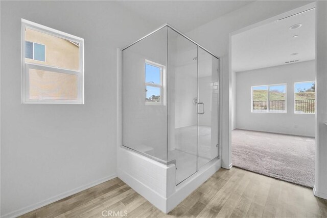 222 Garden Air Ct, Calimesa, CA 92320 - full bath with visible vents, wood finished floors, a stall shower, and baseboards