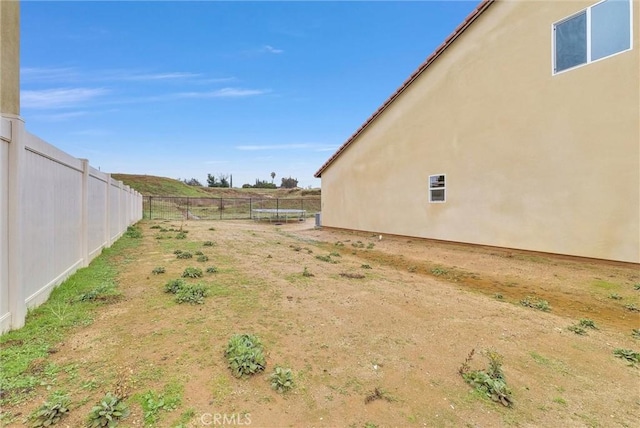 222 Garden Air Ct, Calimesa, CA 92320 - view of yard with a trampoline and fence private yard