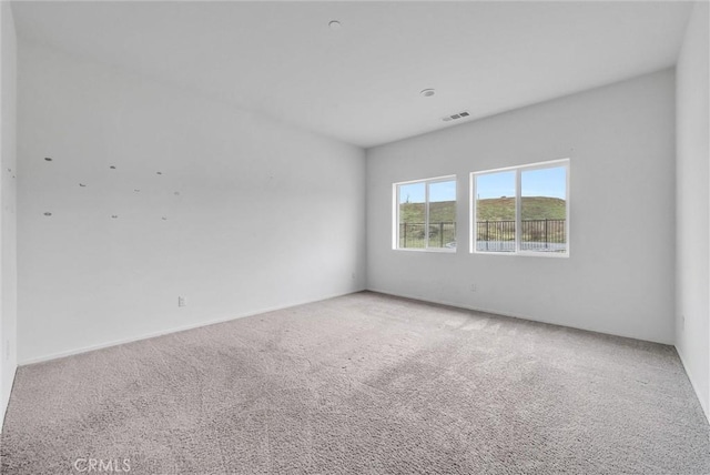 222 Garden Air Ct, Calimesa, CA 92320 - empty room featuring visible vents and light carpet