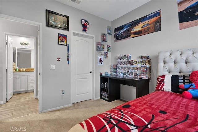 carpeted bedroom featuring visible vents and baseboards