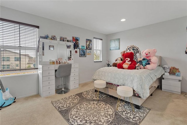 bedroom with light colored carpet
