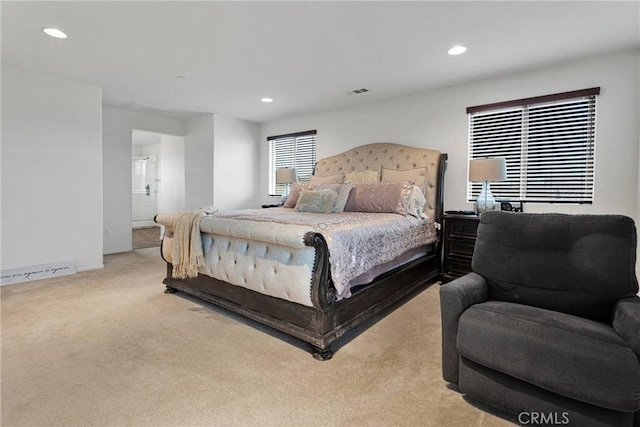 bedroom featuring recessed lighting, light colored carpet, and visible vents