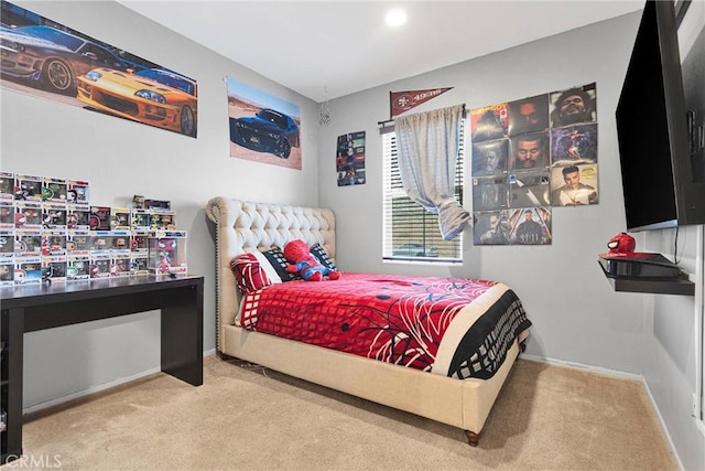 bedroom with baseboards and carpet