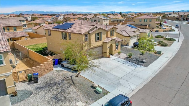 drone / aerial view featuring a residential view and a mountain view