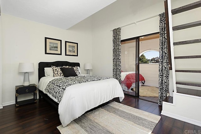 bedroom with hardwood / wood-style floors and baseboards