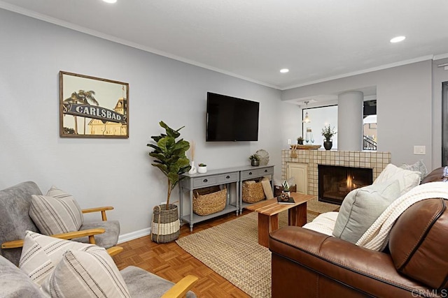 living area with recessed lighting, a fireplace, crown molding, and baseboards