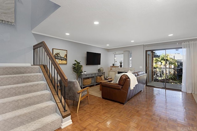 living room with stairs, crown molding, recessed lighting, and baseboards