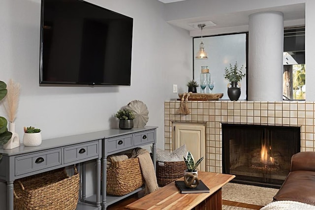 living room featuring a fireplace