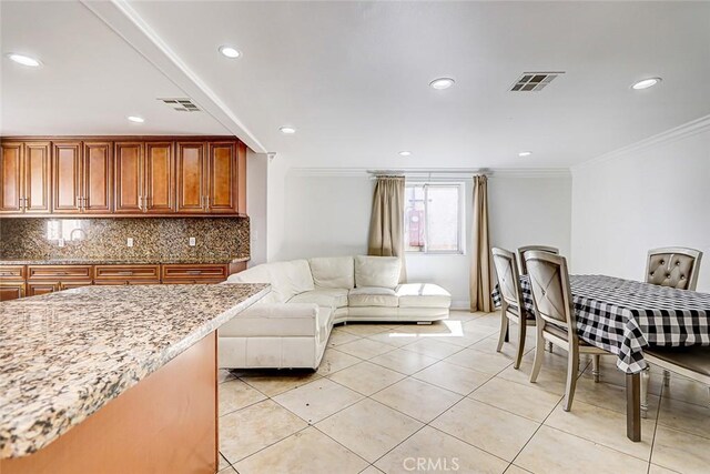 interior space with light tile patterned flooring, visible vents, recessed lighting, and ornamental molding