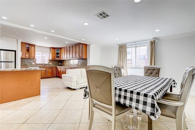 dining area featuring light tile patterned floors, recessed lighting, visible vents, and ornamental molding