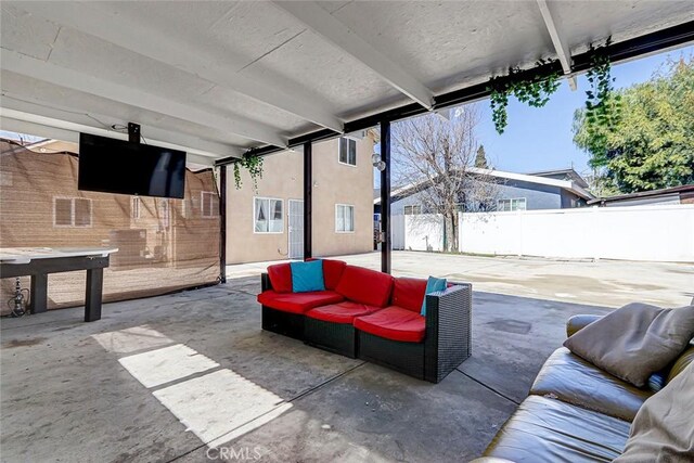 view of patio with outdoor lounge area and a fenced backyard