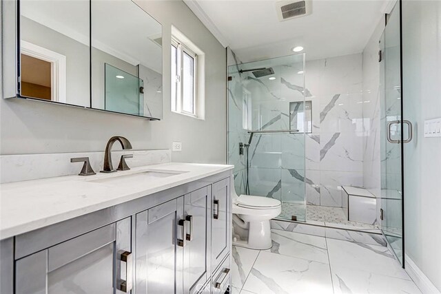 full bath with visible vents, toilet, marble finish floor, a marble finish shower, and vanity