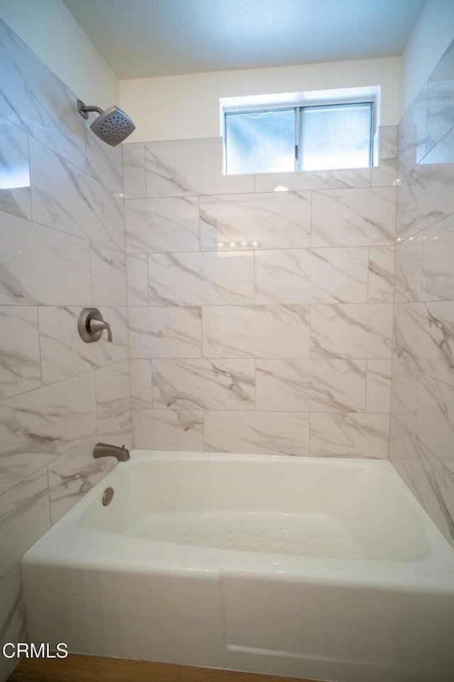 full bathroom with a wealth of natural light