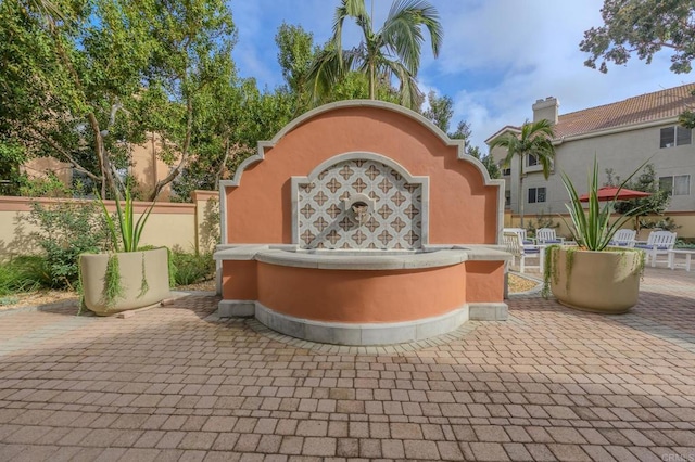 view of patio featuring fence