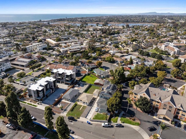 bird's eye view with a residential view and a water view