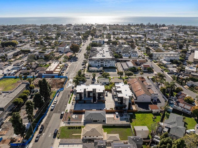 drone / aerial view with a residential view and a water view
