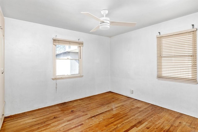 empty room featuring ceiling fan and light wood-type flooring