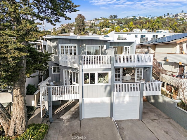 2120 Ocean Way, Laguna Beach, CA 92651 - rear view of house with a garage, concrete driveway, a balcony, and a residential view