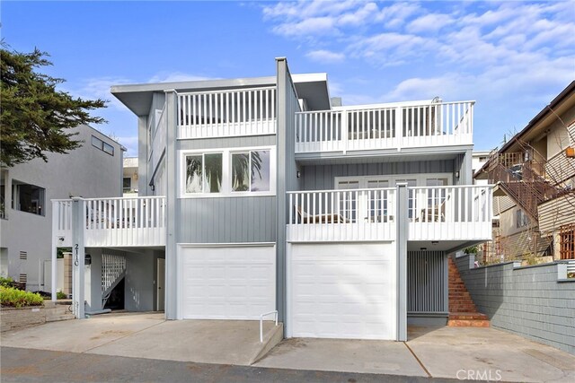 2120 Ocean Way, Laguna Beach, CA 92651 - view of front facade featuring concrete driveway, a balcony, and a garage