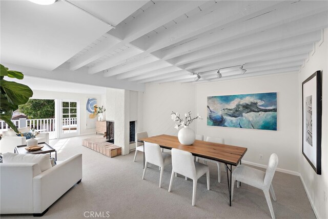 2120 Ocean Way, Laguna Beach, CA 92651 - carpeted dining room featuring beam ceiling, a fireplace, and baseboards