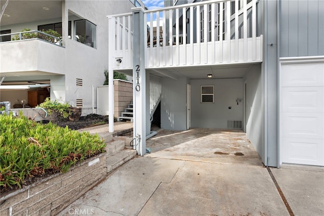 2120 Ocean Way, Laguna Beach, CA 92651 - view of side of home with stucco siding, stairs, and a garage