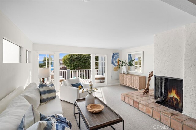 2120 Ocean Way, Laguna Beach, CA 92651 - carpeted living area featuring a healthy amount of sunlight and a large fireplace