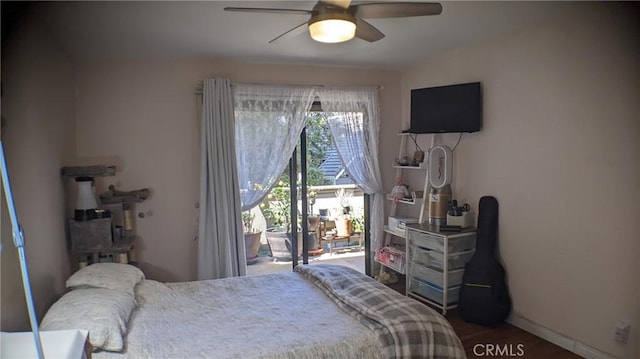 bedroom featuring access to outside, ceiling fan, wood finished floors, and baseboards