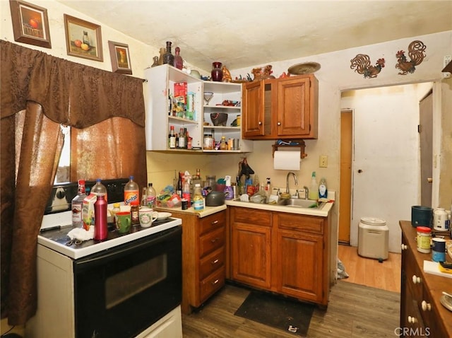 3586 Halika St, Clearlake, CA 95422 - kitchen featuring light countertops, dark wood-style floors, and range with electric cooktop